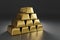 A Pyramid Of Gold Bars On Grey Background