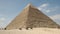 Pyramid of khafre and camel riders at giza near cairo, egypt