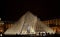 Pyramid Louvre Museum in Paris illuminated in the evening