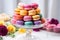 pyramid of macarons on a silver cake stand