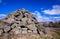 a pyramid made of large, gray boulders