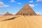 The Pyramid of Menkaure and the Pyramids of the Queens, sunny day view, Egypt