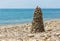 Pyramid pebble on sea beach