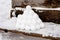 pyramid or a pile of perfect snowballs on frosty winter day in forest or garden outdoor.