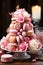 pyramid of pink and white macaroons in candy bar