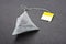 Pyramid shape teabag on the dark background