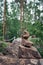 Pyramid of stones, a symbol of the wild Northern nature of Karelia. Coniferous forest