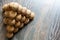 Pyramid of walnuts. Walnuts are on the wooden surface. Macrophotography