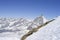 Pyramidal peaks and sheer cliffs of mountain range a sunny day