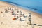 Pyramids of balanced stones on the beach in summer