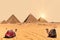 The Pyramids and camels in Giza desert, Egypt