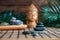 Pyramids of gray zen stones with green leaves and Buddha statue. Concept of harmony, balance and meditation, spa, massage, relax