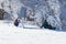PYRENEES, ANDORRA - FEBRUARY 12, 2019: Two snowboarders sit photographed on the edge of the slope among the picturesque