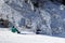 PYRENEES, ANDORRA - FEBRUARY 12, 2019: Two snowboarders sit photographed on the edge of the slope among the picturesque