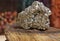 Pyrite Specimen on Raw Tigers Eye Rock With Dried Herbs in Background