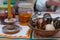 Pysanka, Ukrainian traditional Easter eggs, handwritten with hot wax and handpainted with homemade dye, in clay plate, wax candle