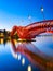 The Python Bridge, Amsterdam, the Netherlands. A bridge in the city at night. The bridge on the blue sky background during the blu