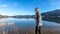 PÃ¶rtschach - A girl in a beanie walking along the lake side