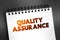 QA Quality Assurance - systematic process of determining whether a product or service meets specified requirements, text on