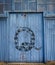 QAnon snake graffiti on old warehouse door, conspiracy theory secret society concept