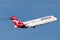 QantasLink Qantas Boeing 717 regional jet airliner taking off from Sydney Airport.