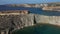 Qarraba Bay flat rock with Ta Babu Cove snorkeling point aerial towards Golden Bay