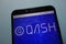 QASH cryptocurrency logo displayed on smartphone