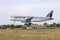 Qatar Airbus above the runway