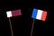 Qatari flag with French flag isolated on black