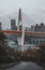 Qian si men suspension bridge tower over Jialing river view from river bank in Chongqing, Southwest China