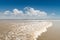 Qiantang river tide against a blue sky