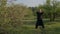 A qigong master and his disciple practice tai chi in nature in a parkqigong master Wushu Taijiquan practices tai Chi in the Park a