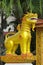 Qilin asian mythological guard goolden statue in Thailand wat