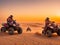 Quad bike in desert at sunset, desert safari in Dubai