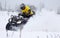 The quad bike driver rides over snow track