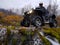 Quad bike in the mountains in the autumn day