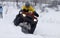 The quad bike\'s driver rides over snow track