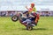 Quad bike wheelie stunt.