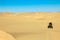 Quad driving people - two happy bikers in sand desert dunes, Africa, Namibia, Namib, Walvis Bay, Swakopmund.