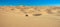 Quad driving in sand desert. ATV standing in middle of nowhere in sand dunes desert with skid marks. Africa, Namibia