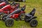 Quad old bikes in the row standing on grass