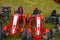 Quad old bikes in the row standing on grass