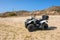 Quad parked at Kolymbithres beach on Paros island, Cyclades, Greece