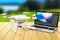 Quadcopter drone and laptop with video software outdoors