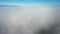 The quadcopter flies in the clouds