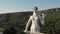 Quadcopter fly to the Kartlis Deda, Mother of Georgia statue in capital of Georgia, Tbilisi. From bottom to top view