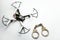 Quadcopter handcuffs white leather background