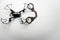 Quadcopter handcuffs white leather background