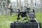 Quadcopter placed on a box, electric pylon, cables and insulators on a background