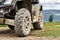 Quadricycle or quad bike on the mountains background on a cloudy day